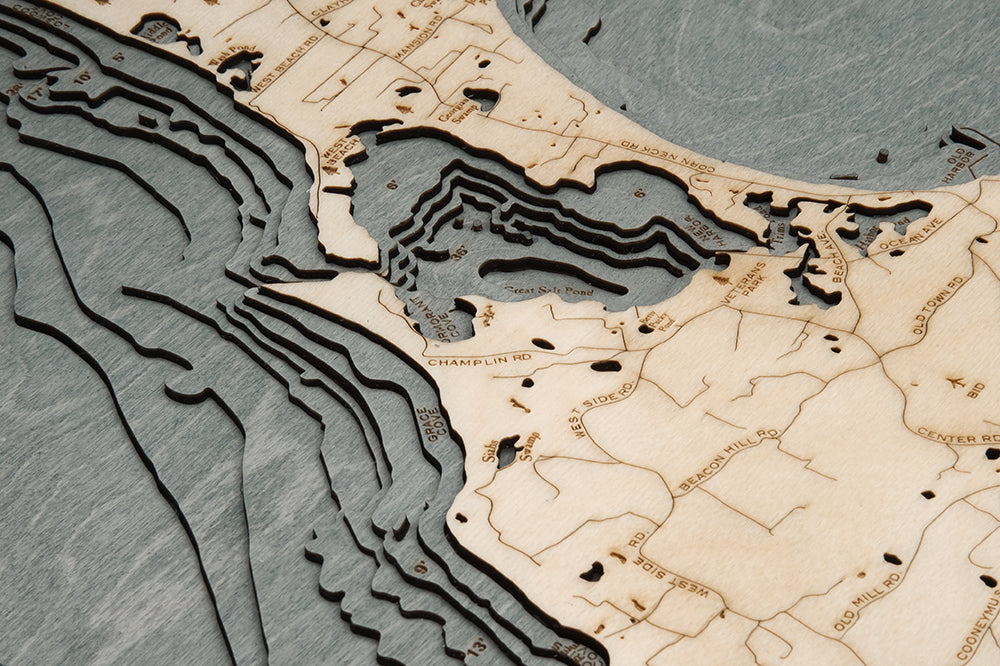 Block Island, Rhode Island 3D layered wood map in laser-cut Baltic birch, shown framed against a light wall