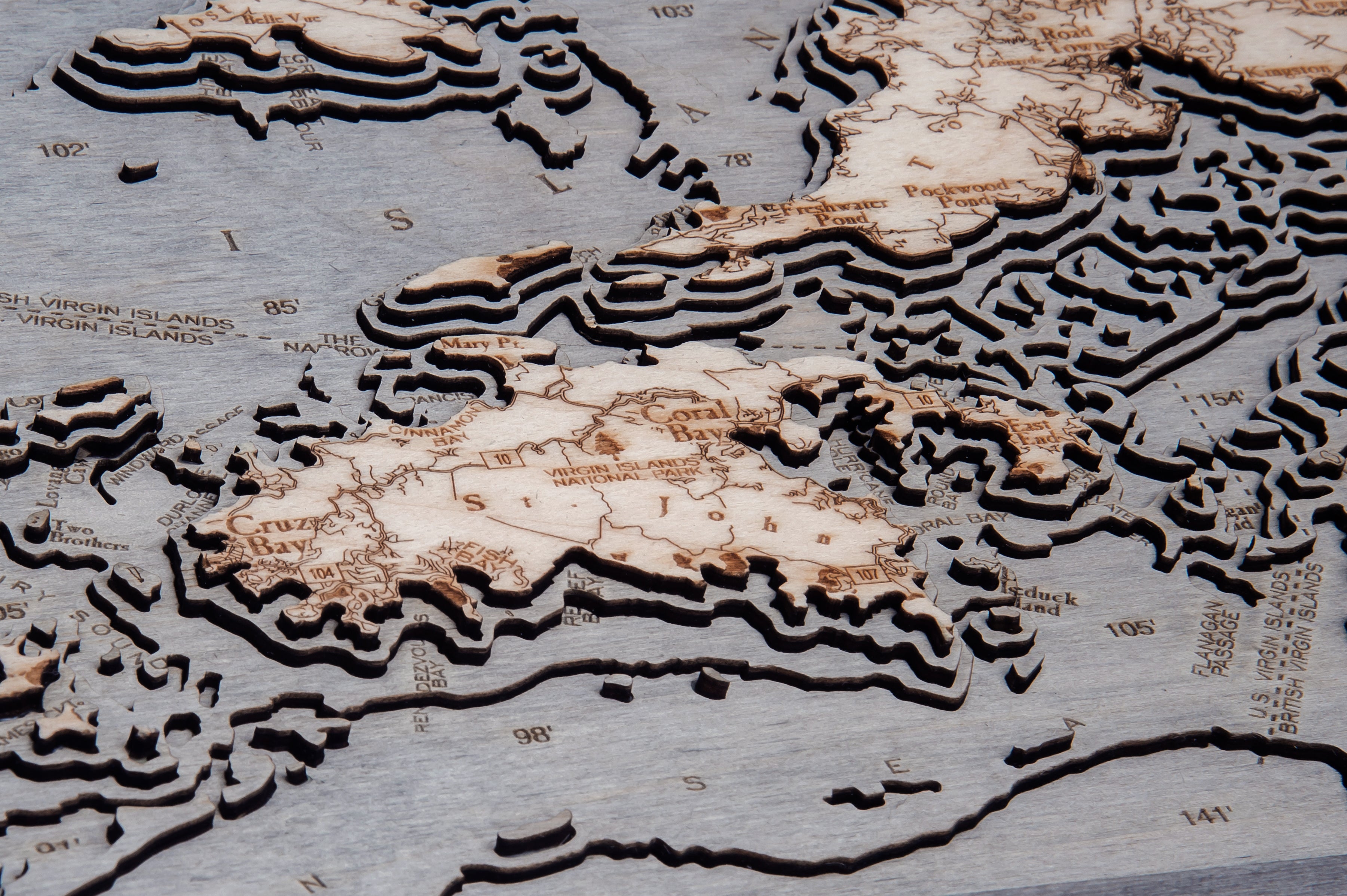 Virgin Islands, Caribbean 3D layered wood map in laser-cut Baltic birch, shown framed against a light wall
