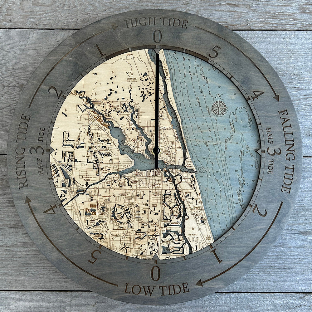 Jupiter, Florida wood wall clock in laser-cut Baltic birch, shown framed against a light wall