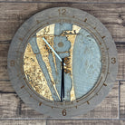 Cocoa Beach, Florida wood tide clock in laser-cut Baltic birch, shown framed against a light wall
