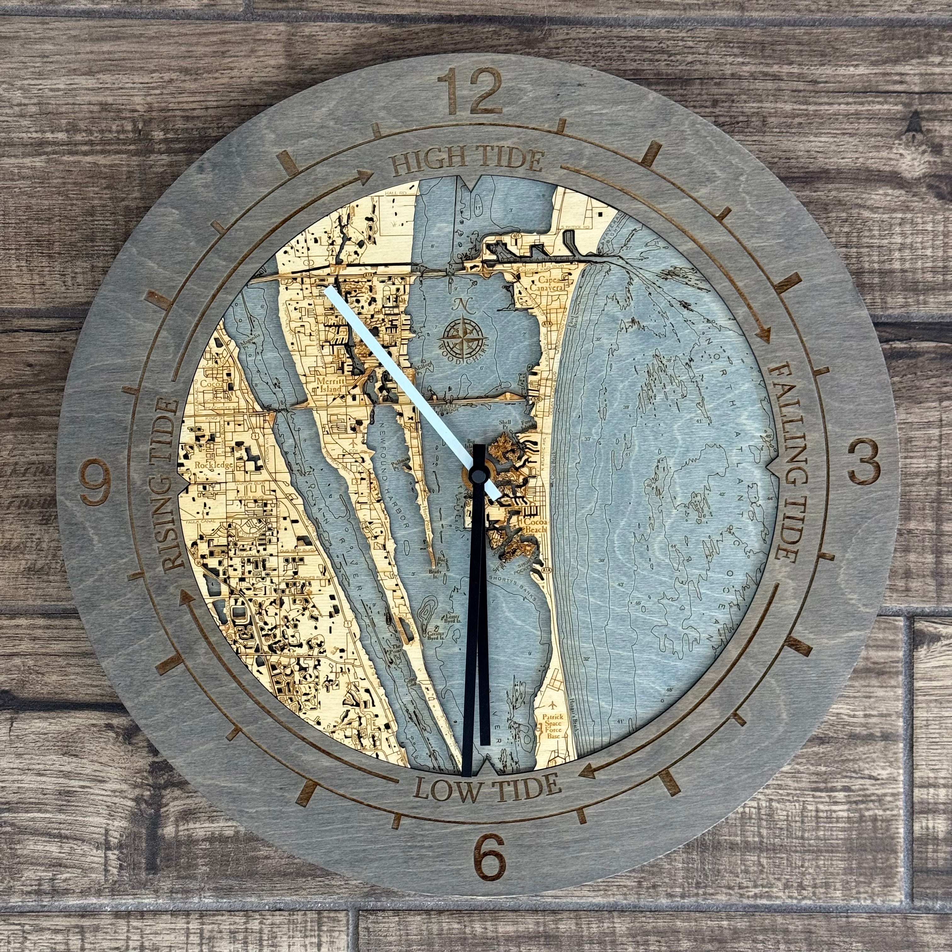Cocoa Beach, Florida wood tide clock in laser-cut Baltic birch, shown framed against a light wall