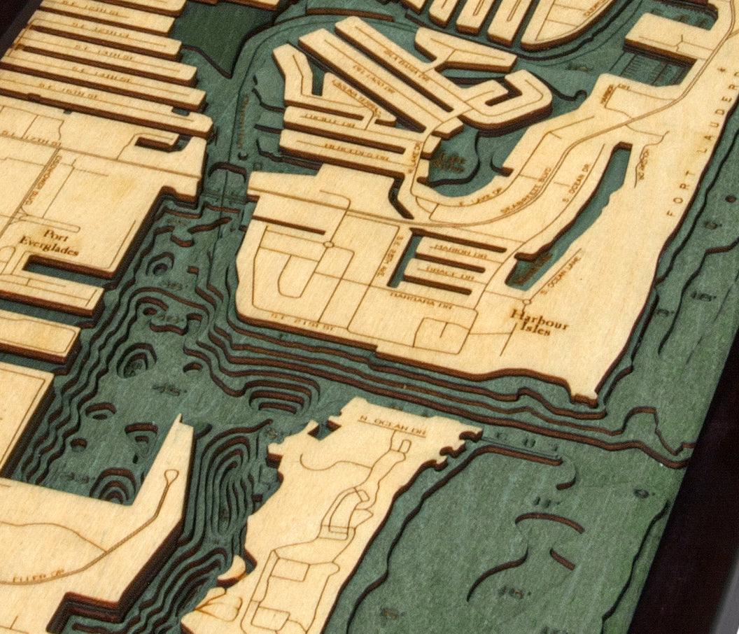 Fort Lauderdale, Florida 3D layered wood map in laser-cut Baltic birch, shown framed against a light wall