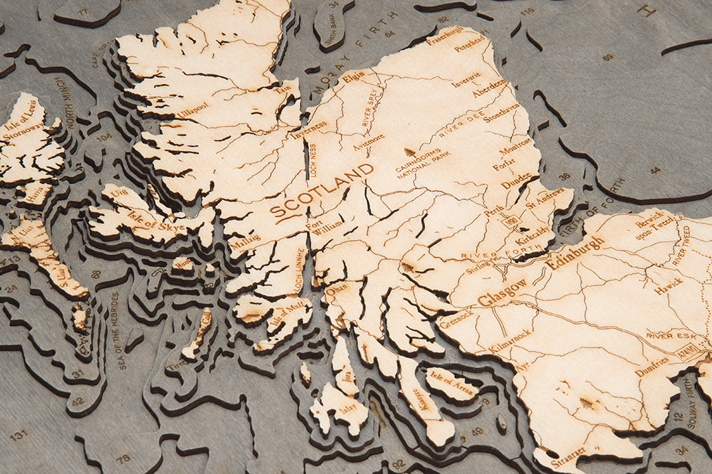 United Kingdom 3D layered wood map in laser-cut Baltic birch, shown framed against a light wall