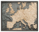 Western Europe 3D layered wood map in laser-cut Baltic birch, shown framed against a light wall