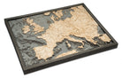 Western Europe 3D layered wood map in laser-cut Baltic birch, shown framed against a light wall