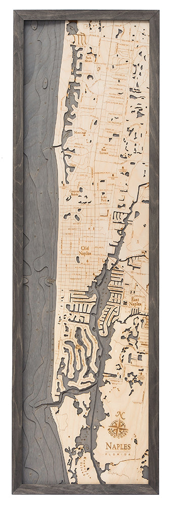 Naples, Florida 3D layered wood map in laser-cut Baltic birch, shown framed against a light wall