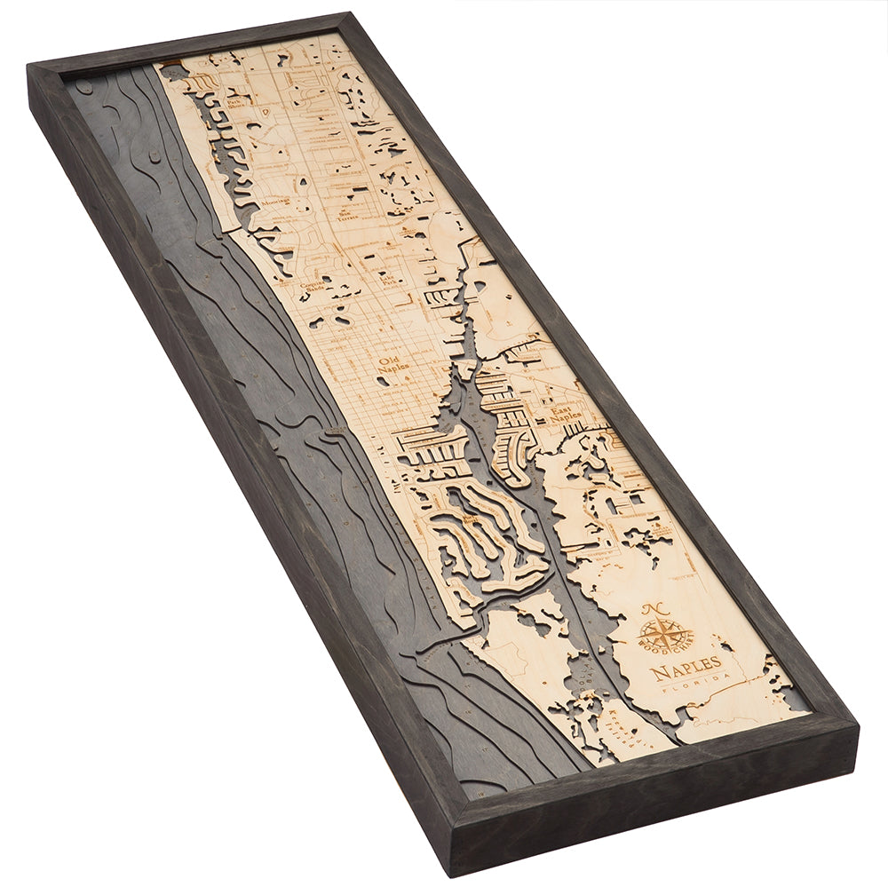 Naples, Florida 3D layered wood map in laser-cut Baltic birch, shown framed against a light wall