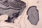 Lake Arrowhead, California 3D layered wood map in laser-cut Baltic birch, shown framed against a light wall
