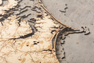 North Carolina Coast 3D layered wood map in laser-cut Baltic birch, shown framed against a light wall