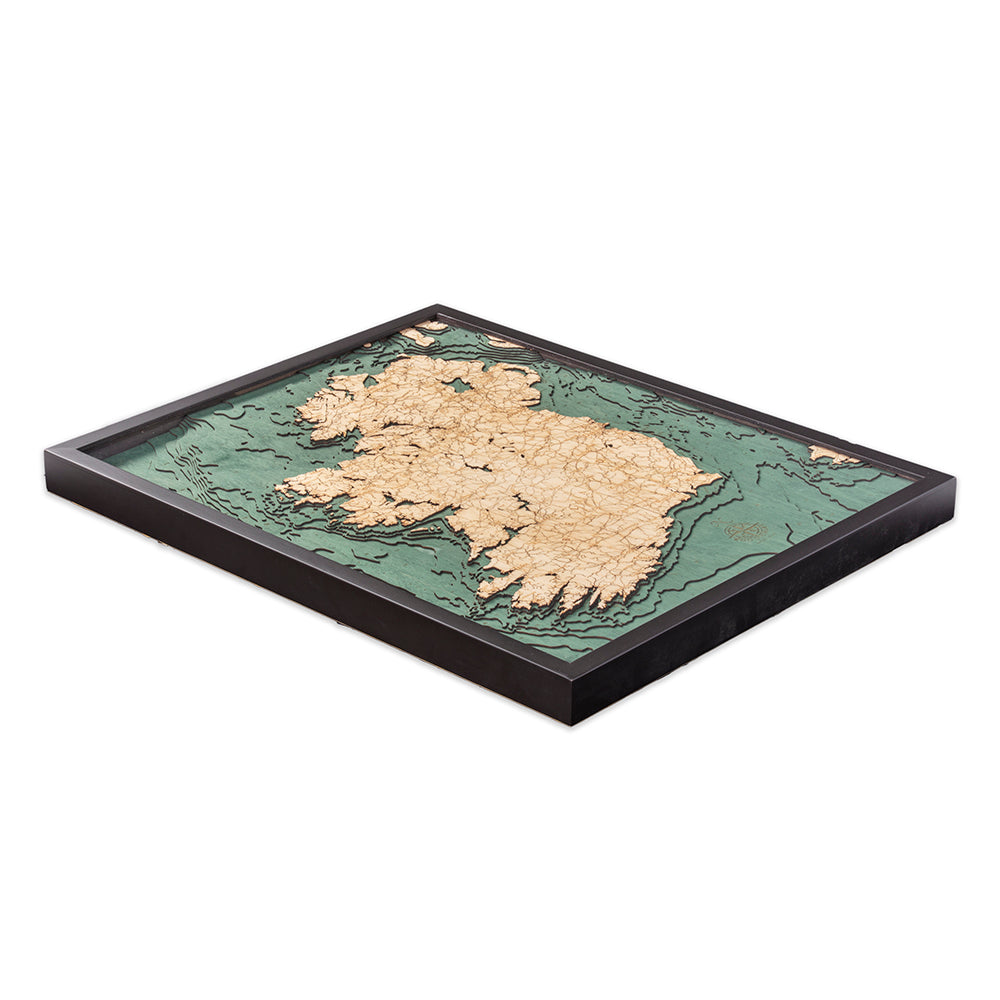 Ireland 3D layered wood map in laser-cut Baltic birch, shown framed against a light wall