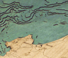 Monterey Bay, California 3D layered wood map in laser-cut Baltic birch, shown framed against a light wall