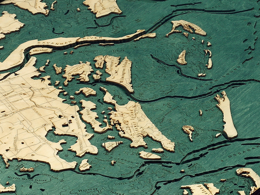 Savannah, Georgia 3D layered wood map in laser-cut Baltic birch, shown framed against a light wall