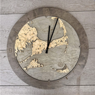 Cape Cod, Massachusetts wood wall clock in laser-cut Baltic birch, shown framed against a light wall