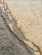 British Columbia Coast 3D layered wood map in laser-cut Baltic birch, shown framed against a light wall