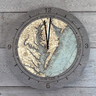 Chesapeake Bay, Maryland wood tide clock in laser-cut Baltic birch, shown framed against a light wall