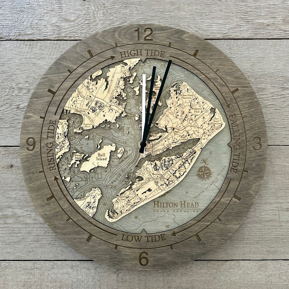 Hilton Head, South Carolina wood tide clock in laser-cut Baltic birch, shown framed against a light wall