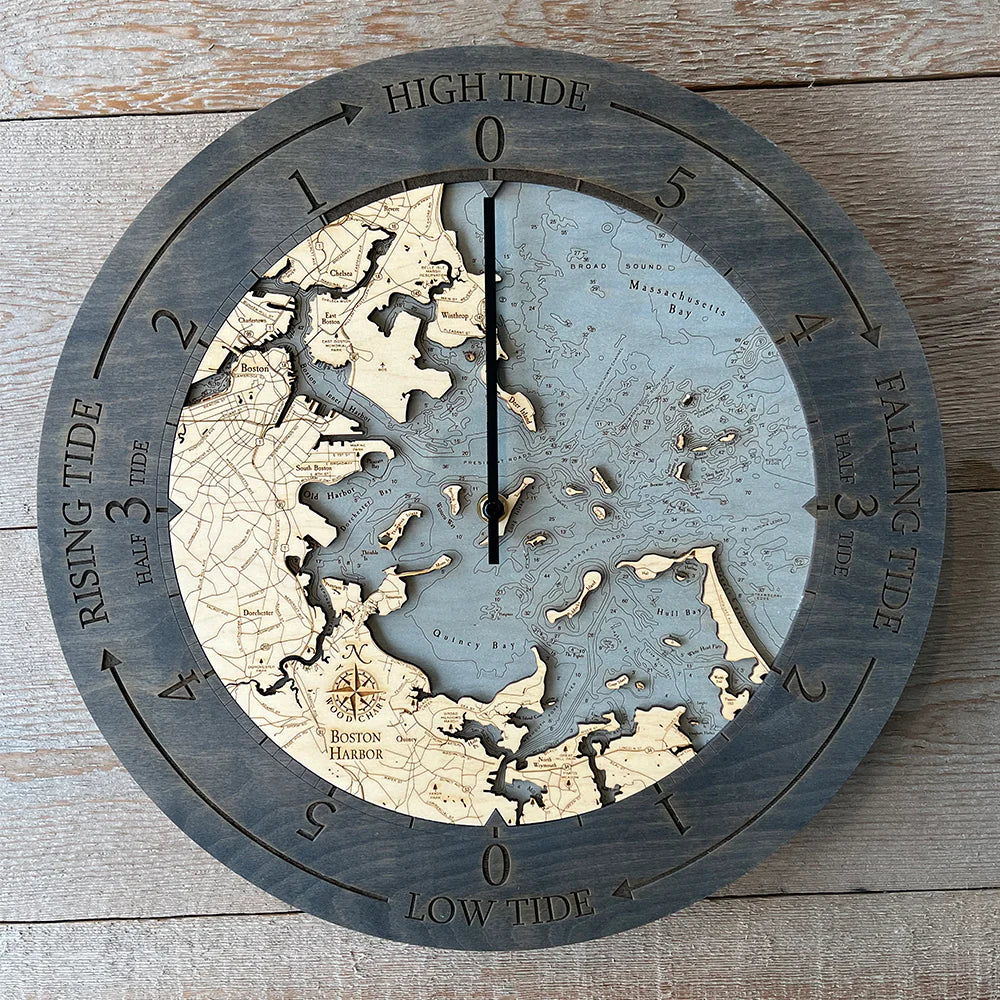 Boston Harbor, Massachusetts wood tide clock in laser-cut Baltic birch, shown framed against a light wall