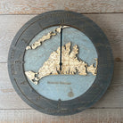 Martha's Vineyard, Massachusetts wood tide clock in laser-cut Baltic birch, shown framed against a light wall