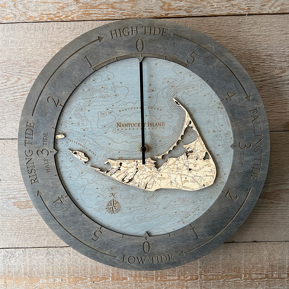 Nantucket, Massachusetts wood tide clock in laser-cut Baltic birch, shown framed against a light wall