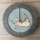 Nantucket, Massachusetts wood tide clock in laser-cut Baltic birch, shown framed against a light wall