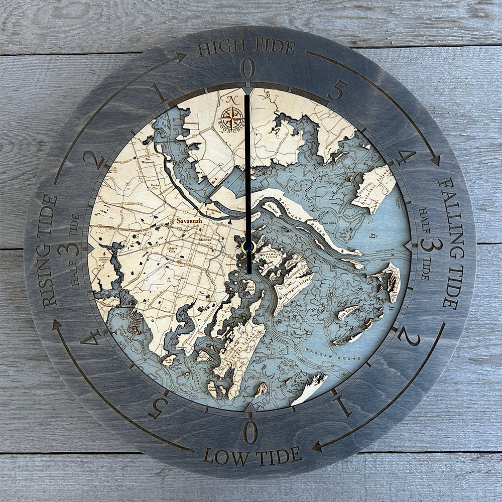 Savannah, Georgia wood tide clock in laser-cut Baltic birch, shown framed against a light wall