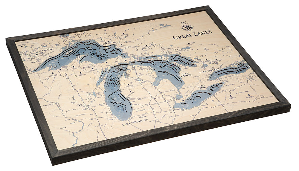 Great Lakes, Michigan 3D layered wood map in laser-cut Baltic birch, shown framed against a light wall
