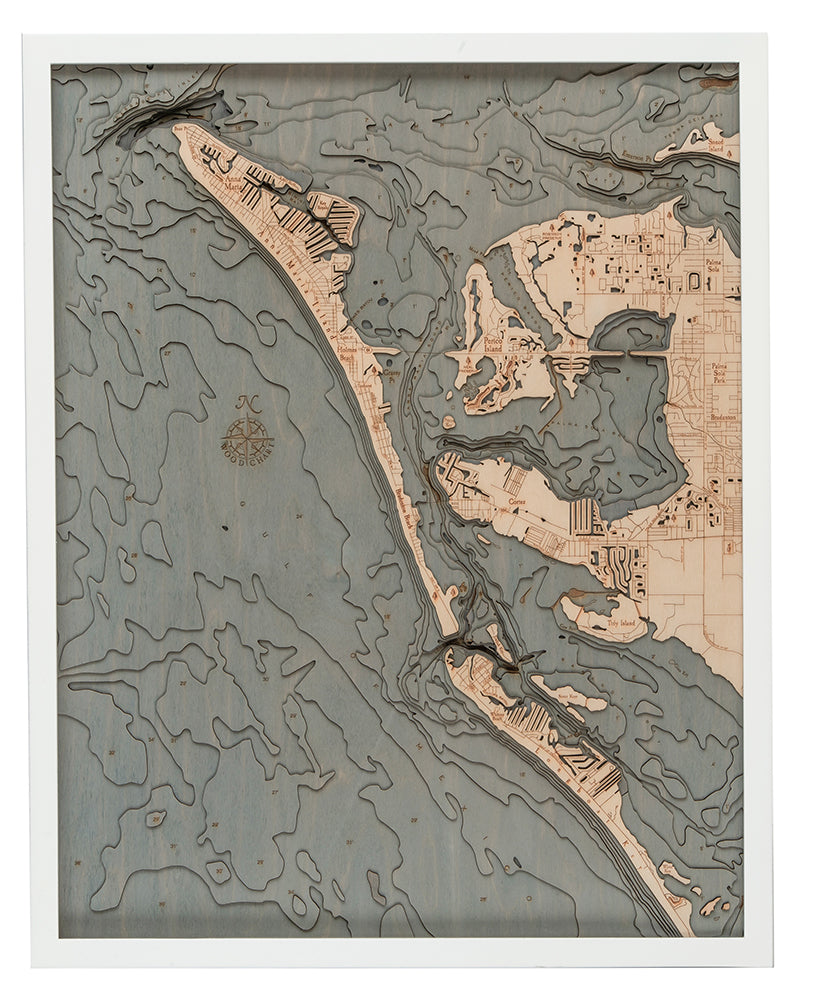 Anna Maria Island, Florida 3D layered wood map in laser-cut Baltic birch, shown framed against a light wall