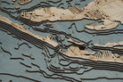 Anna Maria Island, Florida 3D layered wood map in laser-cut Baltic birch, shown framed against a light wall