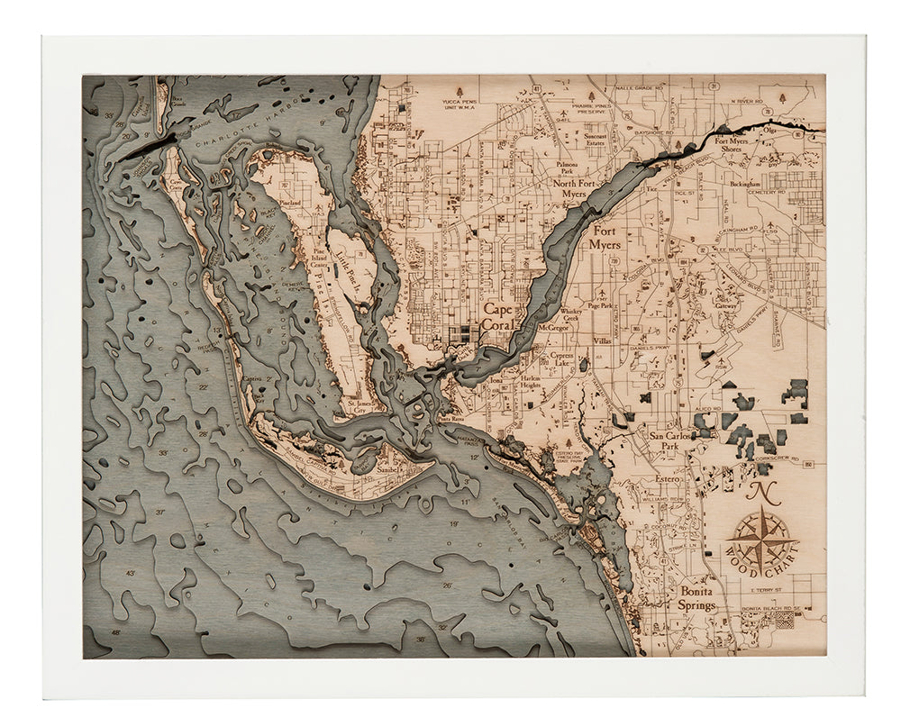 Fort Myers, Florida 3D layered wood map in laser-cut Baltic birch, shown framed against a light wall