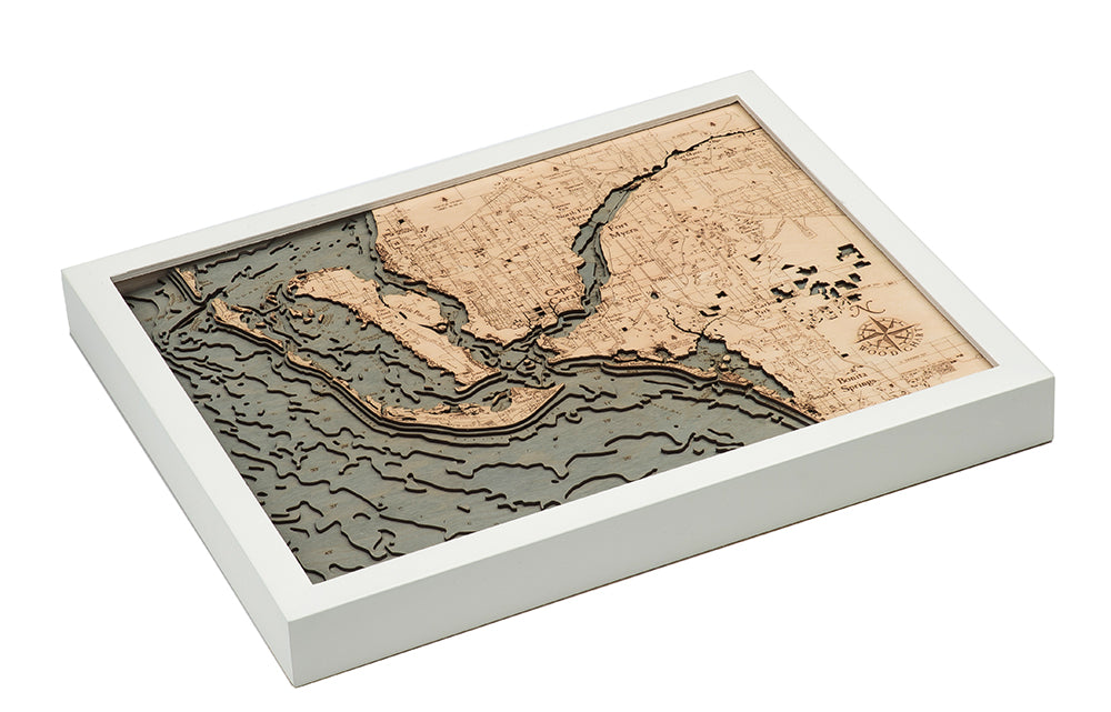 Fort Myers, Florida 3D layered wood map in laser-cut Baltic birch, shown framed against a light wall