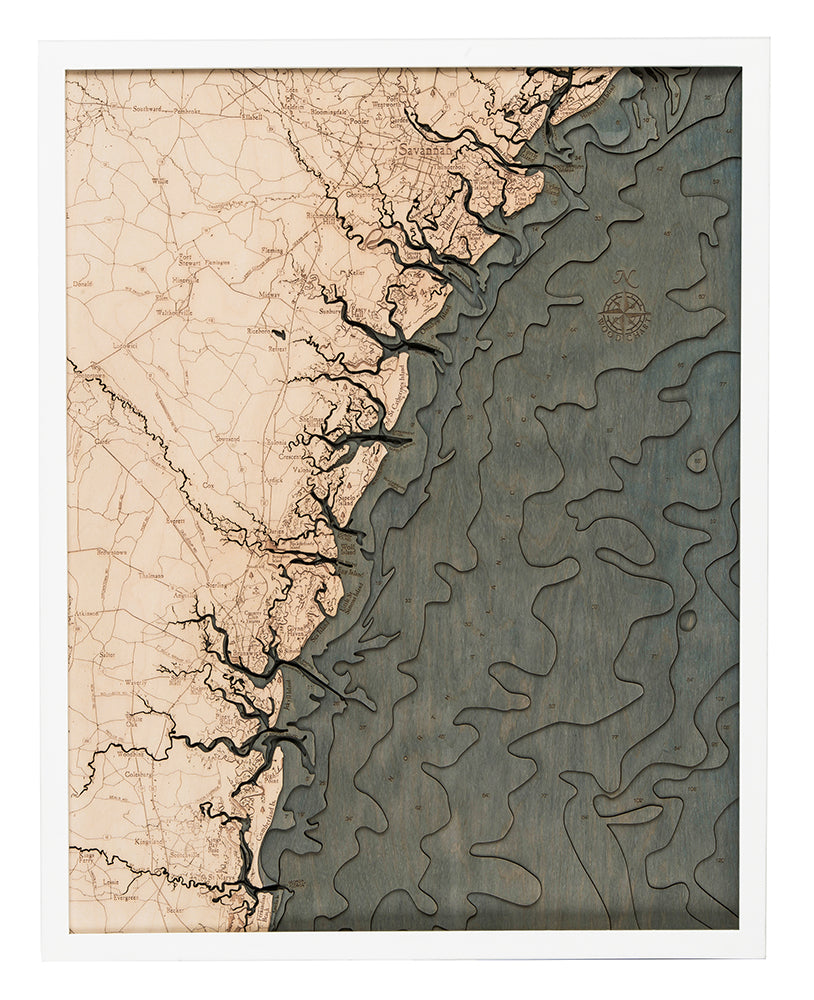 Georgia Coast 3D layered wood map in laser-cut Baltic birch, shown framed against a light wall