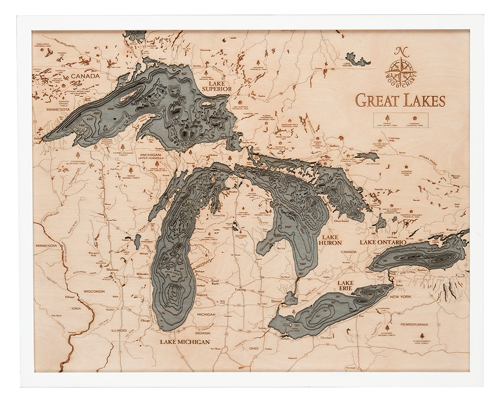 Great Lakes 3D layered wood map in laser-cut Baltic birch, shown framed against a light wall