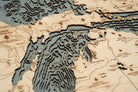 Great Lakes 3D layered wood map in laser-cut Baltic birch, shown framed against a light wall