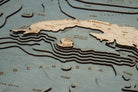 Gulf Of Mexico 3D layered wood map in laser-cut Baltic birch, shown framed against a light wall