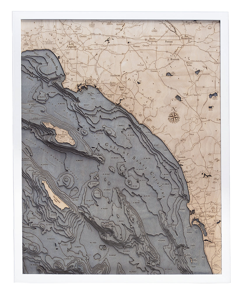 LA to San Diego, California 3D layered wood map in laser-cut Baltic birch, shown framed against a light wall