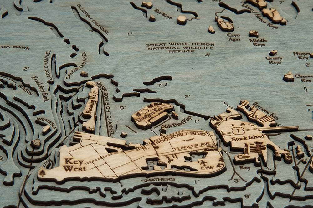 Florida Keys 3D layered wood map in laser-cut Baltic birch, shown framed against a light wall