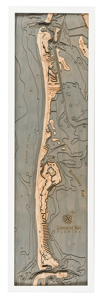 Longboat Key, Florida 3D layered wood map in laser-cut Baltic birch, shown framed against a light wall