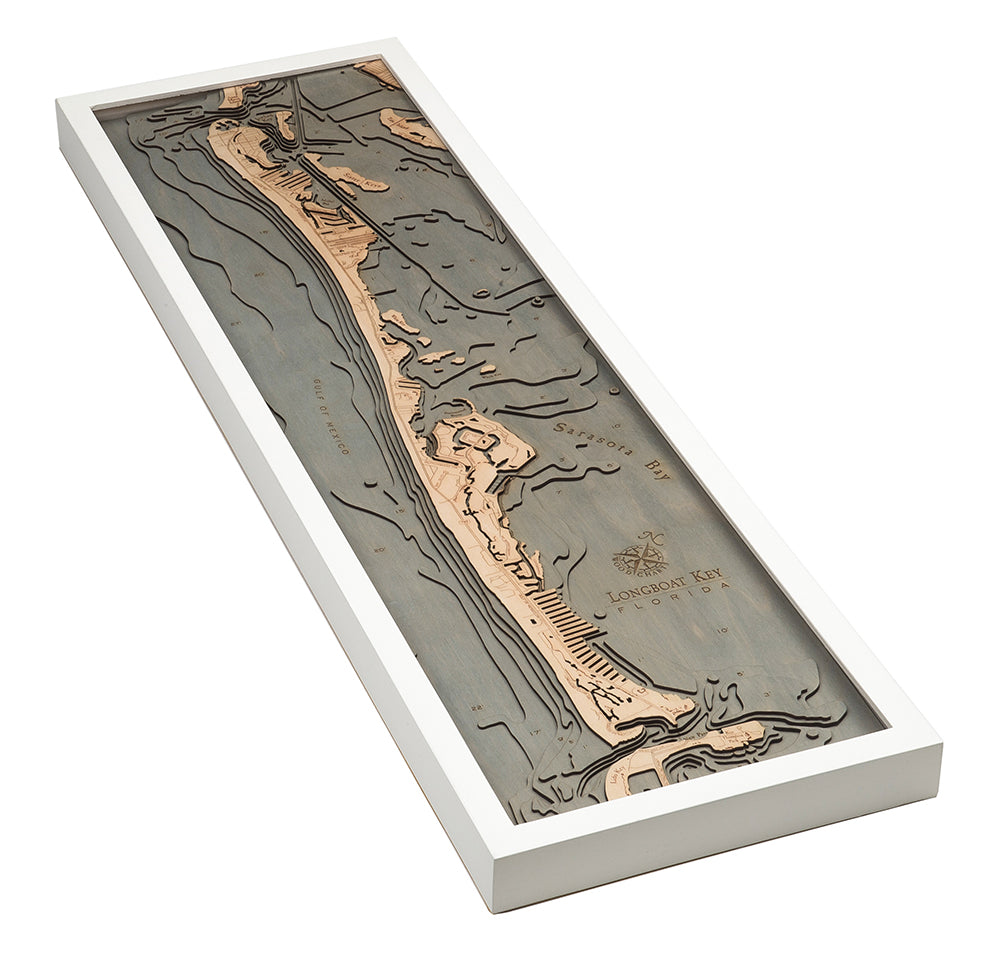 Longboat Key, Florida 3D layered wood map in laser-cut Baltic birch, shown framed against a light wall