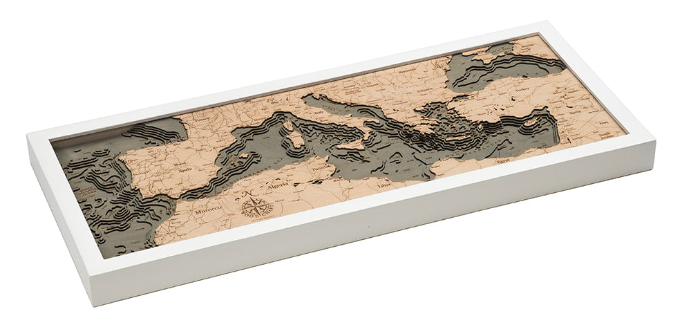 Mediterranean Sea 3D layered wood map in laser-cut Baltic birch, shown framed against a light wall