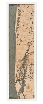 Naples, Florida 3D layered wood map in laser-cut Baltic birch, shown framed against a light wall
