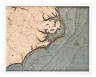 North Carolina Coast 3D layered wood map in laser-cut Baltic birch, shown framed against a light wall