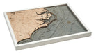 North Carolina Coast 3D layered wood map in laser-cut Baltic birch, shown framed against a light wall