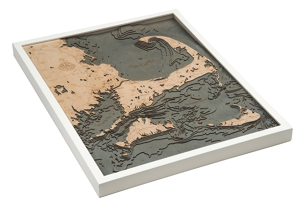 Cape Cod, Massachusetts 3D layered wood map in laser-cut Baltic birch, shown framed against a light wall
