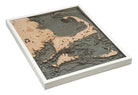 Cape Cod, Massachusetts 3D layered wood map in laser-cut Baltic birch, shown framed against a light wall
