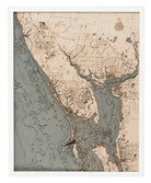 Charlotte Harbor, Florida 3D layered wood map in laser-cut Baltic birch, shown framed against a light wall