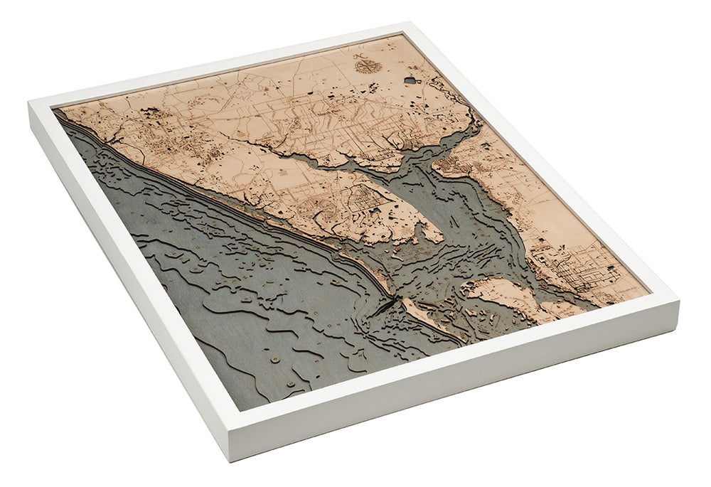 Charlotte Harbor, Florida 3D layered wood map in laser-cut Baltic birch, shown framed against a light wall