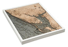 Charlotte Harbor, Florida 3D layered wood map in laser-cut Baltic birch, shown framed against a light wall