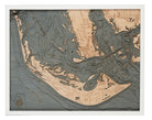 Sanibel Island, Florida 3D layered wood map in laser-cut Baltic birch, shown framed against a light wall