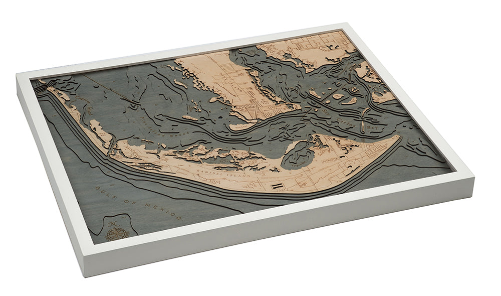 Sanibel Island, Florida 3D layered wood map in laser-cut Baltic birch, shown framed against a light wall