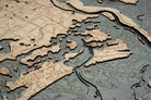 Savannah, Georgia 3D layered wood map in laser-cut Baltic birch, shown framed against a light wall